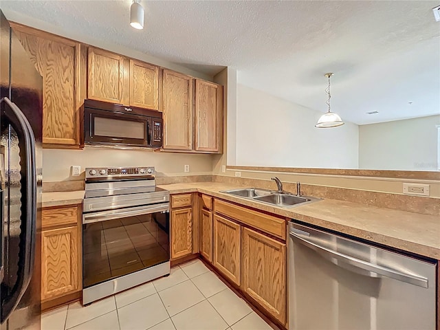 10746 Regent Square Dr Unit 1502, Orlando, FL 32825 - kitchen featuring black appliances, a sink, light tile patterned flooring, light countertops, and a textured ceiling