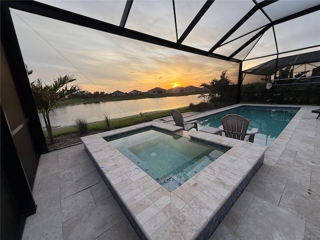 14553 Eagle Branch Dr, Nokomis, FL 34275 - view of swimming pool with a patio area, a water view, glass enclosure, and a pool with connected hot tub