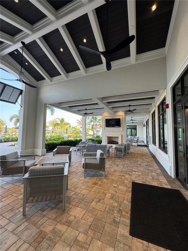 14553 Eagle Branch Dr, Nokomis, FL 34275 - view of patio with an outdoor living space with a fireplace and a ceiling fan