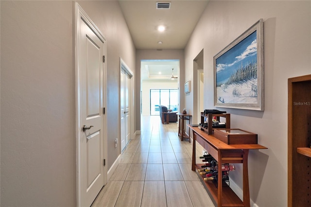 14553 Eagle Branch Dr, Nokomis, FL 34275 - corridor with baseboards and light tile patterned floors