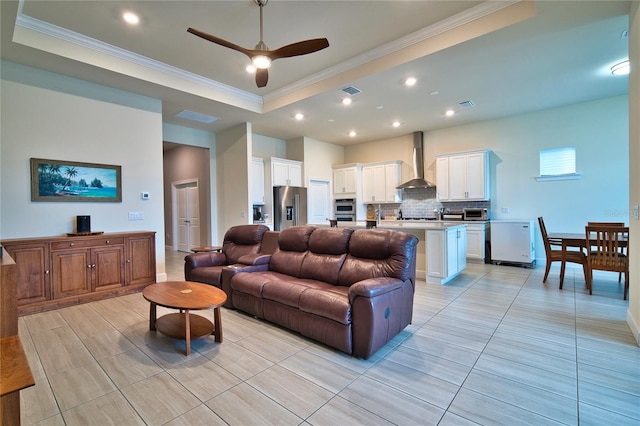 14553 Eagle Branch Dr, Nokomis, FL 34275 - living room with ornamental molding, ceiling fan, a tray ceiling, recessed lighting, and light tile patterned flooring