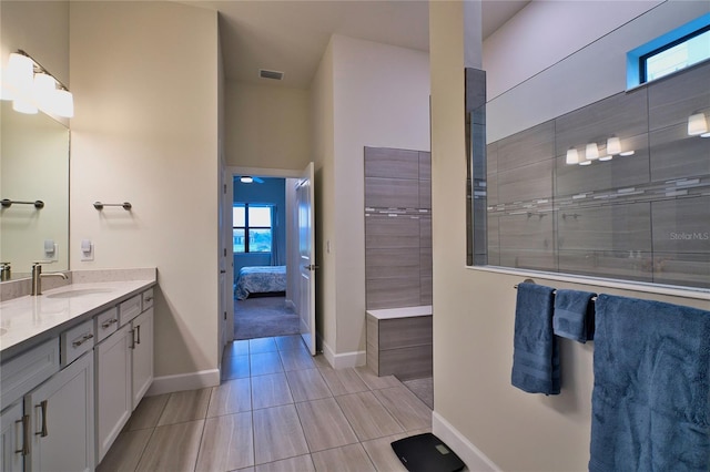 14553 Eagle Branch Dr, Nokomis, FL 34275 - ensuite bathroom with double vanity, baseboards, and tile patterned flooring