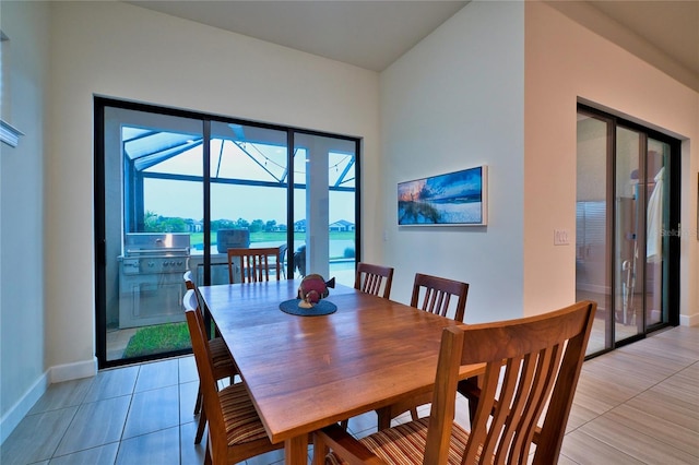 14553 Eagle Branch Dr, Nokomis, FL 34275 - dining room featuring baseboards and light tile patterned flooring