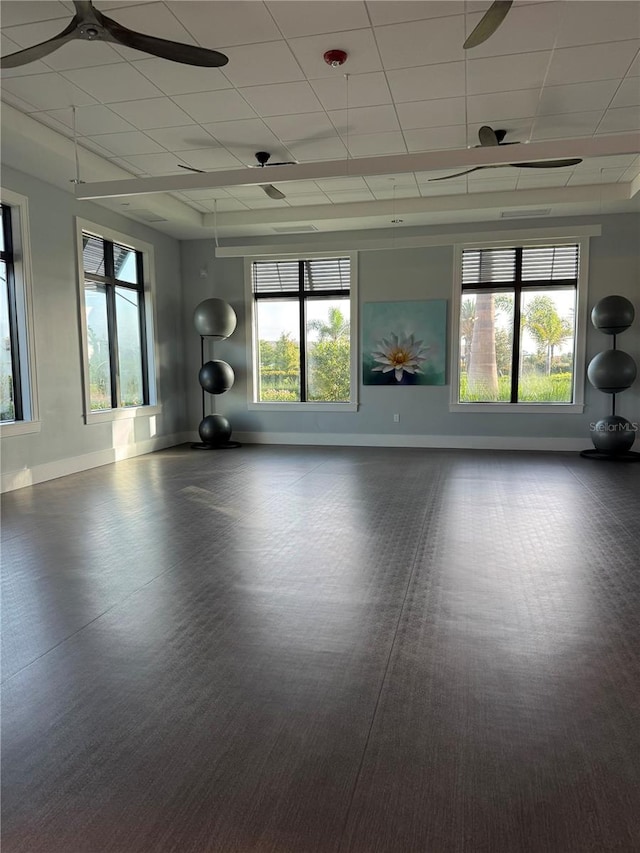 14553 Eagle Branch Dr, Nokomis, FL 34275 - workout area featuring baseboards, ceiling fan, healthy amount of natural light, and a drop ceiling
