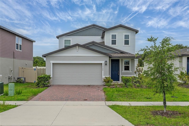 5288 Stephs Field St, Saint Cloud, FL 34771 - view of front of house with decorative driveway and an attached garage