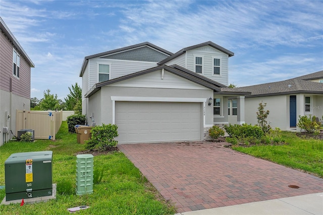 5288 Stephs Field St, Saint Cloud, FL 34771 - traditional-style home with decorative driveway, a garage, and stucco siding