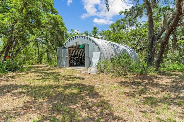 11323 Kijik Trl, Groveland, FL 34736 - view of yard featuring a pole building and an outbuilding