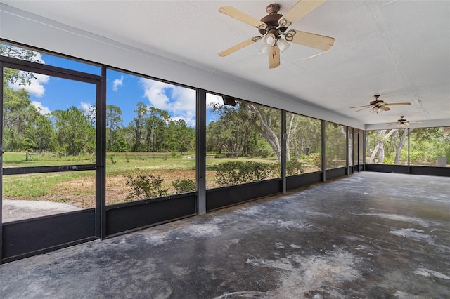 11323 Kijik Trl, Groveland, FL 34736 - unfurnished sunroom featuring ceiling fan and view of scattered trees