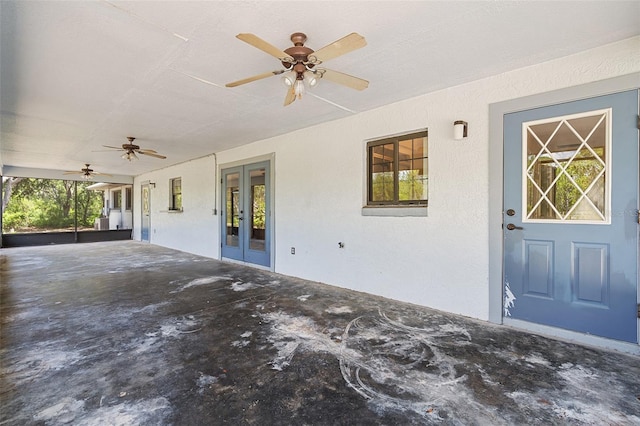 11323 Kijik Trl, Groveland, FL 34736 - property entrance with french doors, a ceiling fan, stucco siding, and a patio area