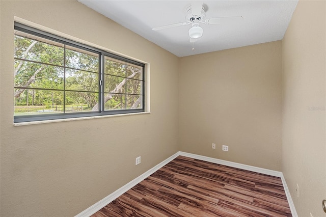 11323 Kijik Trl, Groveland, FL 34736 - spare room with dark wood-type flooring and ceiling fan
