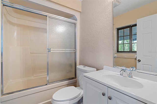 11323 Kijik Trl, Groveland, FL 34736 - full bath featuring a textured wall, vanity, and combined bath / shower with glass door