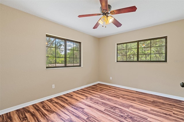 11323 Kijik Trl, Groveland, FL 34736 - spare room with plenty of natural light, wood finished floors, and ceiling fan