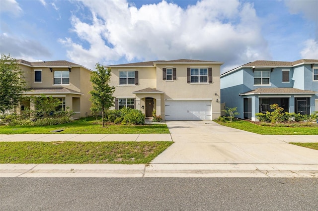 176 Sofia Ln, Lake Alfred, FL 33850 - view of front facade with stucco siding, a garage, concrete driveway, and a front yard