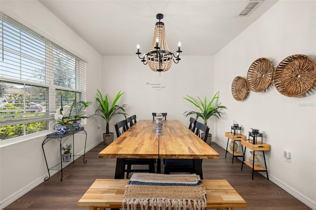 176 Sofia Ln, Lake Alfred, FL 33850 - dining room with healthy amount of natural light, a chandelier, baseboards, and dark wood-style flooring
