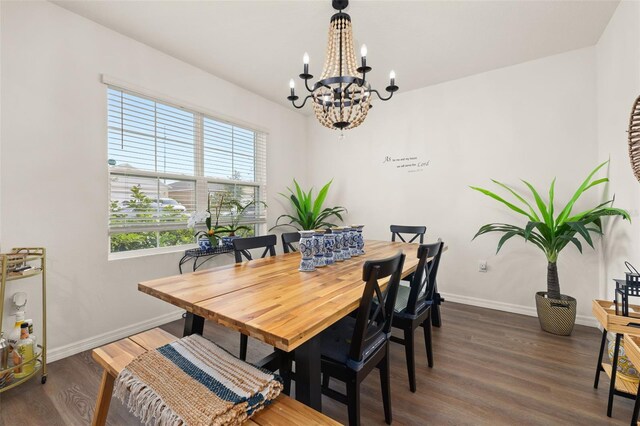 176 Sofia Ln, Lake Alfred, FL 33850 - dining area with a chandelier, baseboards, and wood finished floors
