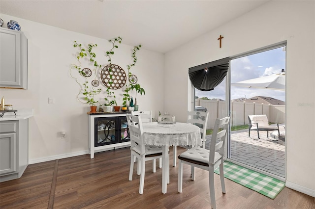 176 Sofia Ln, Lake Alfred, FL 33850 - dining space with dark wood finished floors and baseboards
