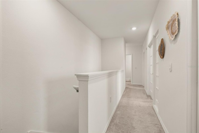 176 Sofia Ln, Lake Alfred, FL 33850 - corridor featuring light colored carpet, recessed lighting, baseboards, and an upstairs landing