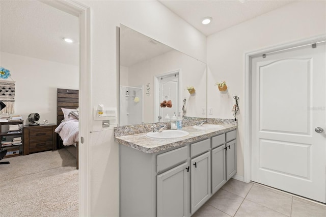 176 Sofia Ln, Lake Alfred, FL 33850 - full bathroom featuring connected bathroom, double vanity, an enclosed shower, and tile patterned flooring
