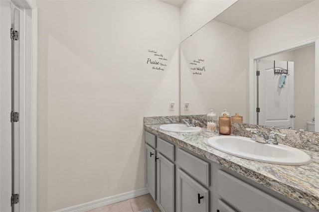 176 Sofia Ln, Lake Alfred, FL 33850 - bathroom with double vanity, baseboards, and tile patterned flooring