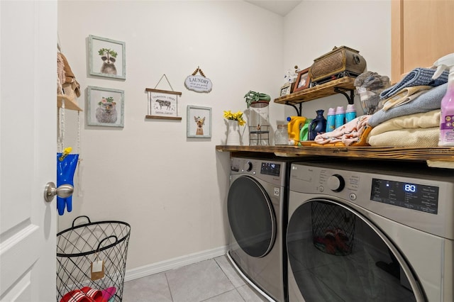 176 Sofia Ln, Lake Alfred, FL 33850 - laundry area featuring washing machine and clothes dryer, light tile patterned flooring, and baseboards