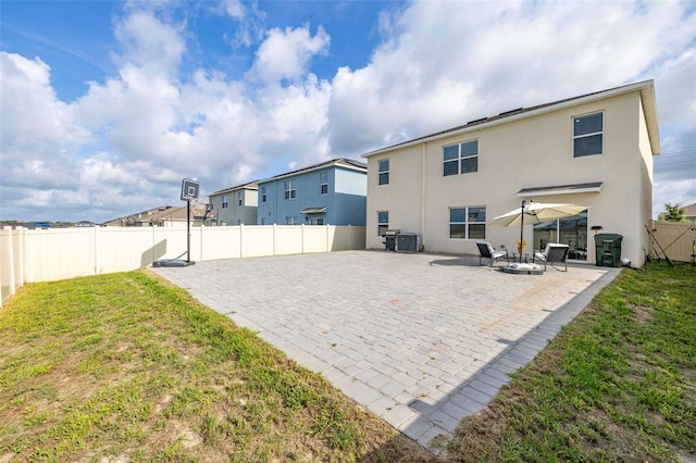 176 Sofia Ln, Lake Alfred, FL 33850 - back of house featuring a patio, stucco siding, and cooling unit