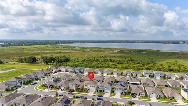 176 Sofia Ln, Lake Alfred, FL 33850 - aerial overview of property's location with a large body of water and nearby suburban area