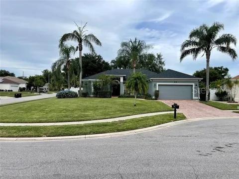 3901 Ballinore Pl, Gotha, FL 34734 - single story home with driveway, an attached garage, and a front lawn