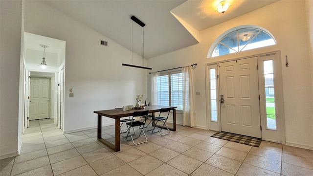 3901 Ballinore Pl, Gotha, FL 34734 - entrance foyer with high vaulted ceiling, light tile patterned flooring, and baseboards