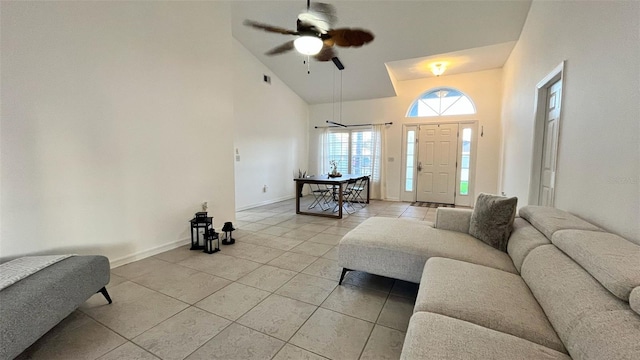 3901 Ballinore Pl, Gotha, FL 34734 - living area with light tile patterned floors, high vaulted ceiling, baseboards, and ceiling fan