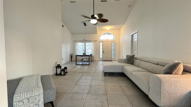 3901 Ballinore Pl, Gotha, FL 34734 - living room featuring a high ceiling, a ceiling fan, light tile patterned floors, and baseboards