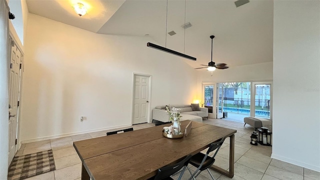 3901 Ballinore Pl, Gotha, FL 34734 - dining space featuring high vaulted ceiling, light tile patterned flooring, ceiling fan, and baseboards