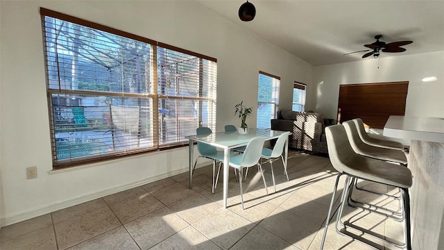 3901 Ballinore Pl, Gotha, FL 34734 - dining area with tile patterned floors, a ceiling fan, and baseboards
