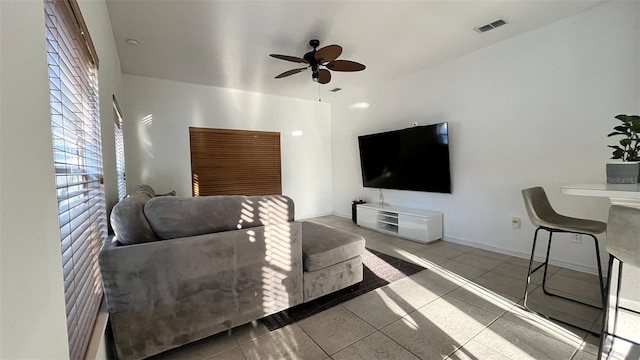 3901 Ballinore Pl, Gotha, FL 34734 - tiled living room featuring a ceiling fan and baseboards