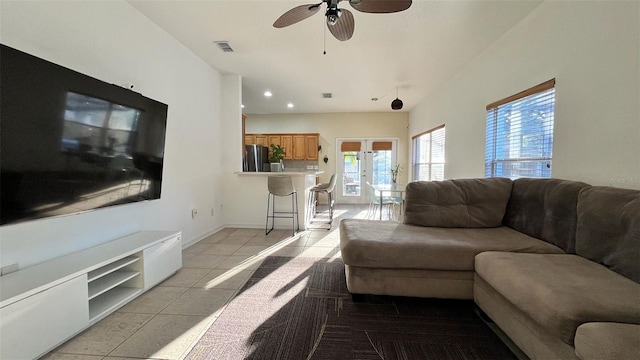 3901 Ballinore Pl, Gotha, FL 34734 - living room with healthy amount of natural light, light tile patterned floors, ceiling fan, and recessed lighting