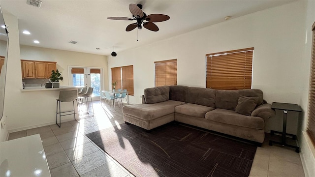 3901 Ballinore Pl, Gotha, FL 34734 - living room with light tile patterned floors, ceiling fan, french doors, baseboards, and recessed lighting