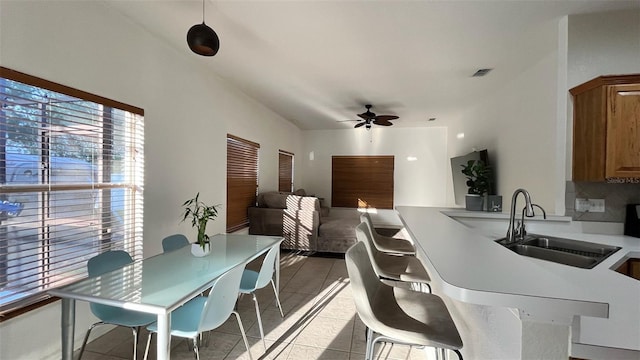 3901 Ballinore Pl, Gotha, FL 34734 - kitchen with a ceiling fan, a sink, healthy amount of natural light, and light tile patterned floors