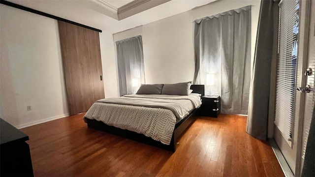 3901 Ballinore Pl, Gotha, FL 34734 - bedroom featuring wood finished floors, ornamental molding, and baseboards