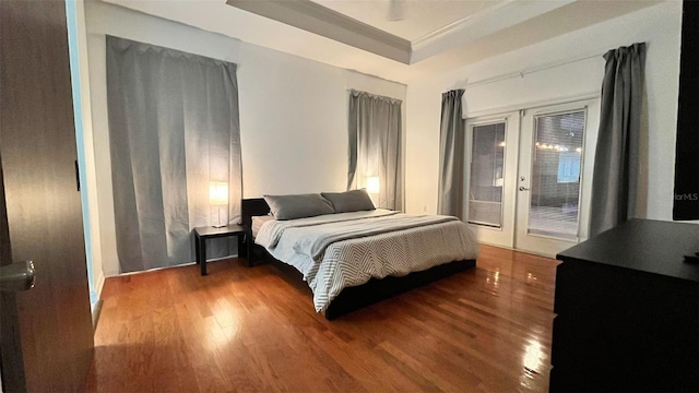 3901 Ballinore Pl, Gotha, FL 34734 - bedroom with french doors, wood finished floors, a tray ceiling, and access to exterior