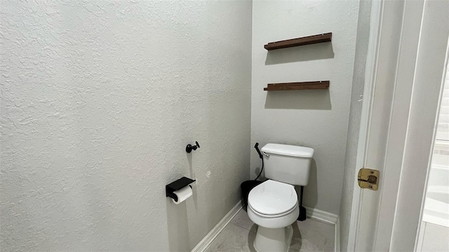 3901 Ballinore Pl, Gotha, FL 34734 - bathroom with toilet, baseboards, and tile patterned flooring
