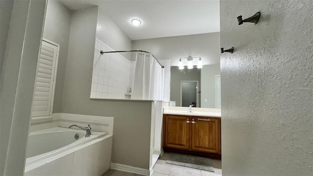 3901 Ballinore Pl, Gotha, FL 34734 - full bathroom featuring a garden tub, vanity, a shower with shower curtain, tile patterned flooring, and a textured wall