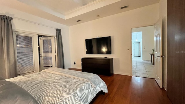 3901 Ballinore Pl, Gotha, FL 34734 - bedroom featuring wood finished floors, access to exterior, a heating unit, and baseboards