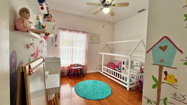 3901 Ballinore Pl, Gotha, FL 34734 - bedroom with wood finished floors and a ceiling fan