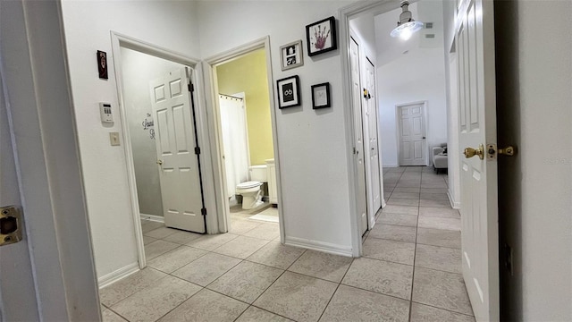 3901 Ballinore Pl, Gotha, FL 34734 - corridor featuring light tile patterned floors and baseboards