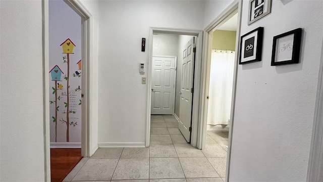 3901 Ballinore Pl, Gotha, FL 34734 - hallway featuring light tile patterned flooring and baseboards