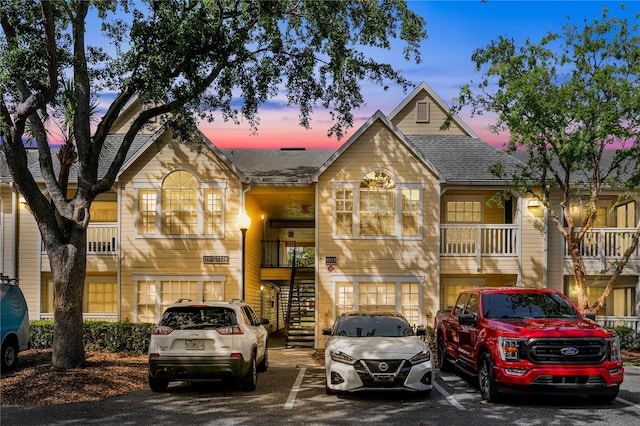 1025 S Hiawassee Rd Unit 2225, Orlando, FL 32835 - townhome / multi-family property with stairs, uncovered parking, and a shingled roof