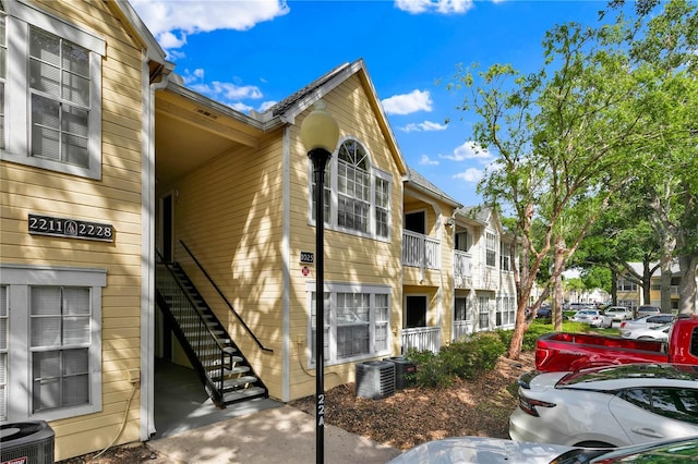 1025 S Hiawassee Rd Unit 2225, Orlando, FL 32835 - view of property with stairs and cooling unit