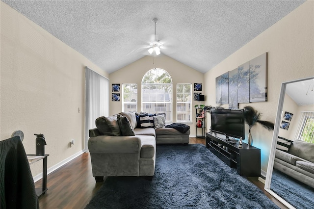 1025 S Hiawassee Rd Unit 2225, Orlando, FL 32835 - living room with ceiling fan, dark wood finished floors, lofted ceiling, a textured ceiling, and baseboards