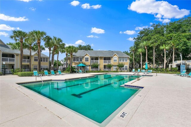 1025 S Hiawassee Rd Unit 2225, Orlando, FL 32835 - community pool featuring a patio area