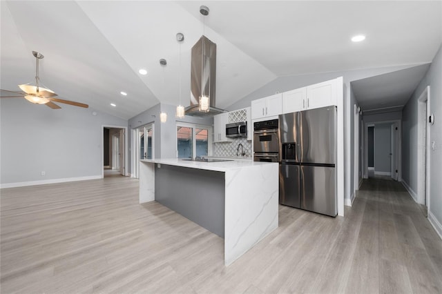 5015 Nassau Cir Unit 4, Orlando, FL 32808 - kitchen with stainless steel appliances, island range hood, vaulted ceiling, ceiling fan, and light wood-type flooring