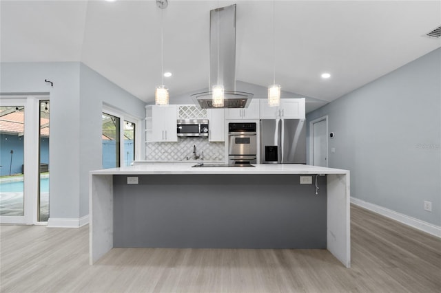 5015 Nassau Cir Unit 4, Orlando, FL 32808 - kitchen with stainless steel appliances, island range hood, white cabinets, light wood-style flooring, and recessed lighting